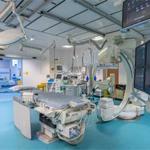 Ultra-modern clinical area with hi-tech bed and machinery - MRI scanner in next room