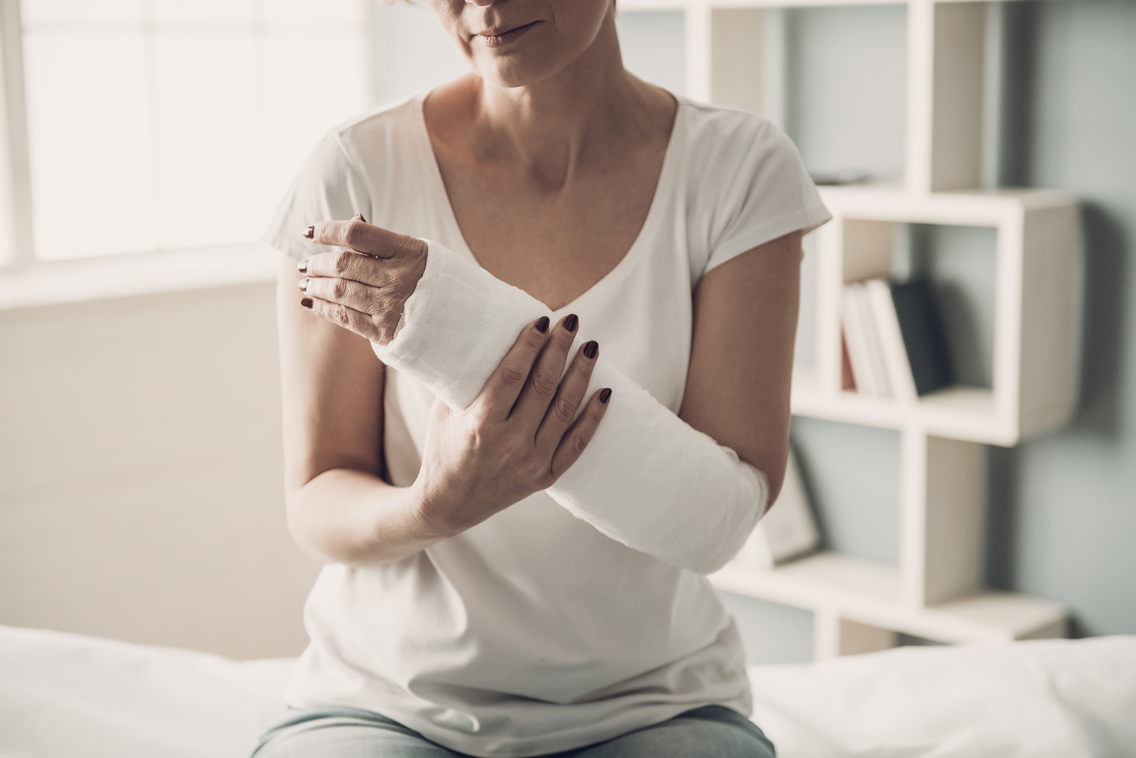 unidentified woman with her arm in a sling