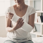 unidentified woman with her arm in a sling
